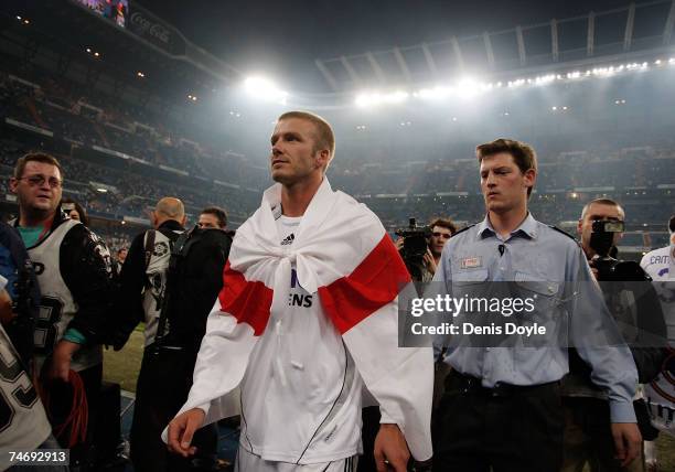 David Beckham of Real Madrid wears the english flag dreped over his shoulders after Real won the Primera Liga after the Primera Liga match between...
