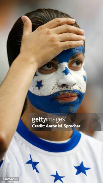 Honduras fan watches as her team plays against Guadeloupe during their quarterfinal match of the CONCACAF Gold Cup 2007 tournament at Reliant Stadium...