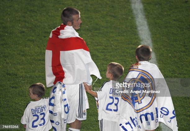 David Beckham of Real Madrid celebrates with his sons Cruz, Romeo and Brooklyn after the La Liga match between Real Madrid and Mallorca at the...
