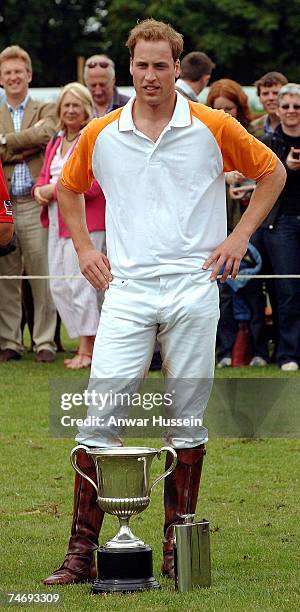 Prince William stands with his winning cup at a charity polo match for Apes Hill Club Barbados against Churchill Retirement Living for the Calcot...