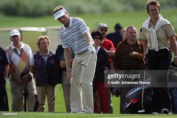 Golfer Bernhard Langer hits a shot during the opening of Hartl Golf Resort on June 18 in Penning, Germany.