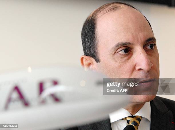 Qatar Airways Chief Executive Officer Akbar Al-Baker listens questions after signing a contract during the 47th Paris International air show at Le...