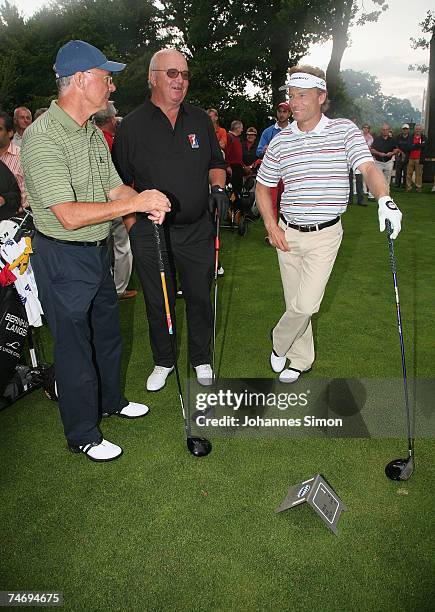 Franz Beckenbauer, Alois Hartl and Bernhard Langer chat together during the opening of Hartl Golf Resort on June 18 in Penning, Germany.