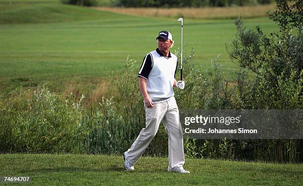 Boris Becker walks during the opening of Hartl Golf Resort on June 18 in Penning, Germany.