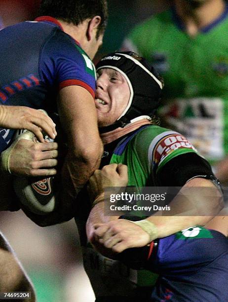 Alan Tongue of the Raiders is tackled during the round 14 NRL match between the Newcastle Knights and the Canberra Raiders at EnergyAustralia Stadium...