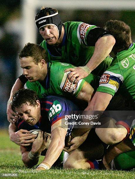 Kurt Gidley of the Knights is tackled during the round 14 NRL match between the Newcastle Knights and the Canberra Raiders at EnergyAustralia Stadium...