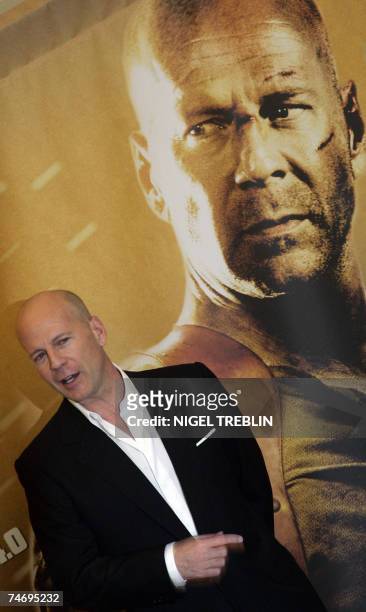 Actor Bruce Willis poses for photographers 18 June 2007 during a photo call for his latest film ?Live Free or Die Hard? the 4th of the ?Die Hard?...