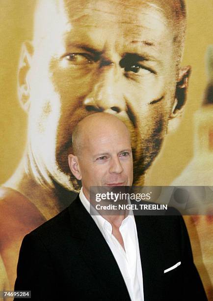 Actor Bruce Willis poses for photographers 18 June 2007 during a photo call for his latest film ?Live Free or Die Hard? the 4th of the ?Die Hard?...