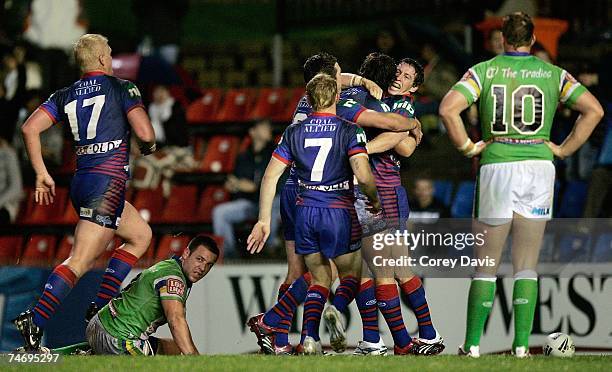 Knights players celebrate Chris Bailey's try during the round 14 NRL match between the Newcastle Knights and the Canberra Raiders at EnergyAustralia...