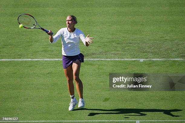 Julia Schruff of Germany plays a volley in her match against Elena Baltacha of Great Britain during the International Women's Open Tennis...