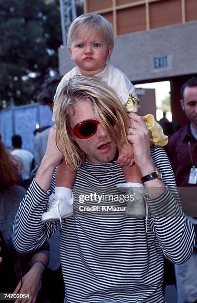 Kurt Cobain of Nirvana and daughter Frances Bean Cobain at the Universal Ampitheater in Universal City, California