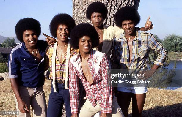 Tito Jackson, Marlon Jackson, Michael Jackson, Randy Jackson and Jackie Jackson of The Jacksons pose during a publicity photo shoot after the band...