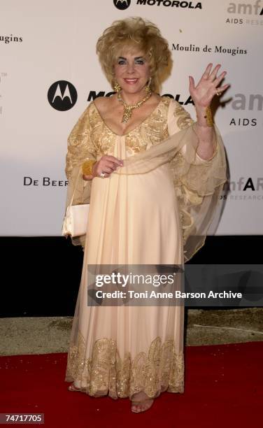 Dame Elizabeth Taylor wearing Gianfranco Ferre at the Le Moulin de Mougins in Cannes, France.