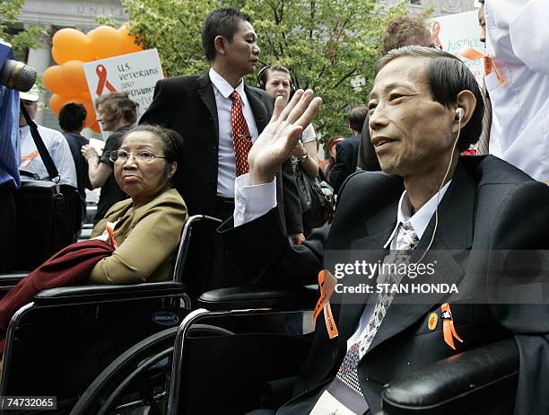 New York, UNITED STATES: TO GO WITH AFP STORY BY CATHERINE HOURS "US-VIETNAM-WAR-HEALTH-WEAPONS" Nguyen Van Quy and Nguyen Thi Hong , Vietnamese...