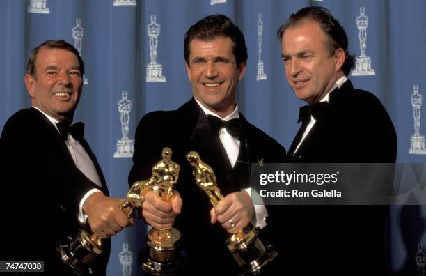 Alan Ladd Jr., Mel Gibson, and Bruce Davey at the Dorothy Chandler Pavilion in Los Angeles, California