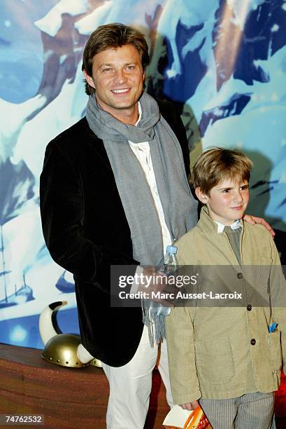 Laurent Delahousse and son at the Rex Theater in Paris, France.