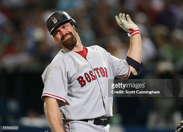 Kevin Youkilis of the Boston Red Sox reacts after being called out on strikes against the Atlanta Braves on June 18, 2007 at Turner Field in Atlanta,...