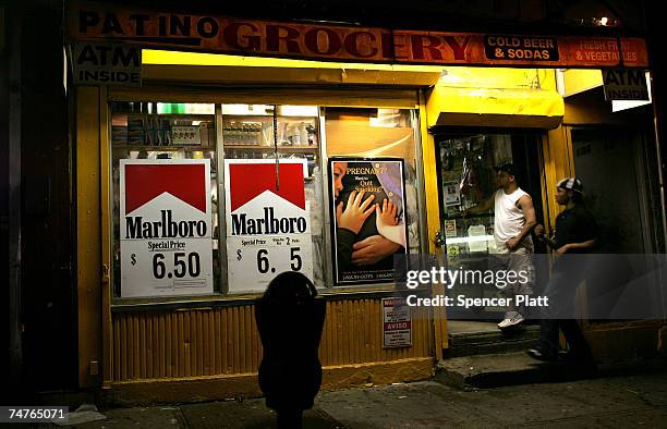 An evening scene outside of a bodega grocery store around the corner from where Bolivar Cruz was killed while working at his bodega last week June...