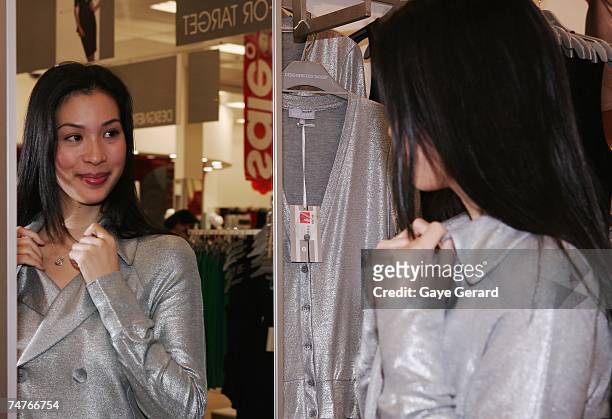 Shopper buys items from the newly launched Josh Goot for Target budget fashion collection on the first morning of release at The Broadway Shopping...