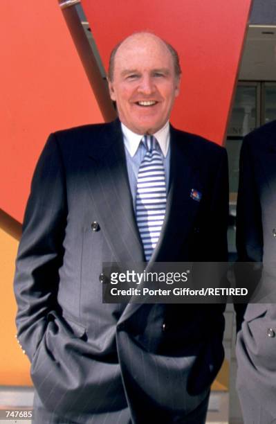 John F. Welch Jr., General Electric Chairman, poses in front of the NBC Peacock logo May 12, 1997 in New York City during the presentation of NBC...
