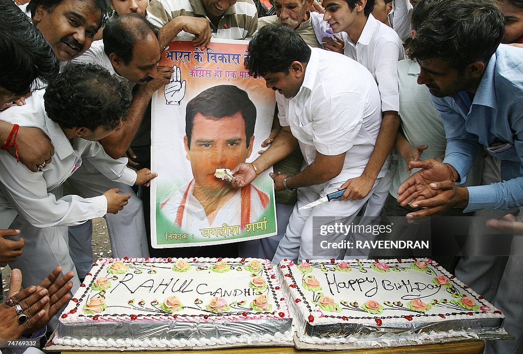 Indian Youth Congress supporters cut a h...