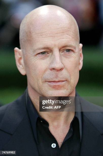 Actor Bruce Willis poses as he arrives for the German Premiere for his latest film ?Live Free or Die Hard? the 4th of the ?Die Hard? series, 18 June...