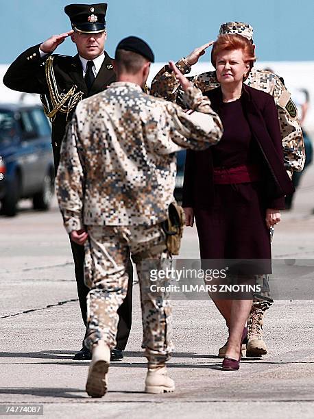 Latvian President Vaira Vike-Freiberga greets a soldier during a homecoming ceremony 19 June 2007 at Riga airport. A contingent of more than a...