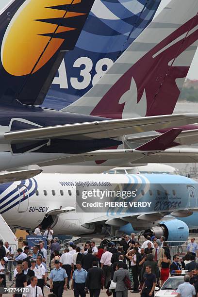 Visitors wal at the 47th Paris International air show 19 June 2007 at Le Bourget Airport. The Paris Air Show began on Monday for industry...