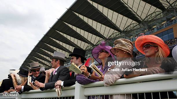 Crowds watch The St James's Palace Stakes Race run at Ascot Racecourse during the First day of The Royal Meeting held at the Berkshire track on June...