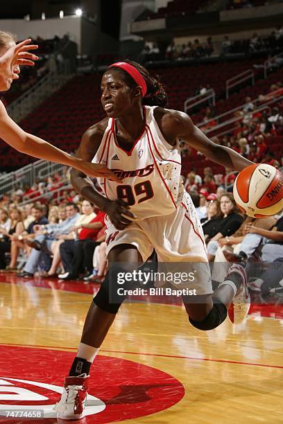 Hamchetou Maiga-Ba of the Houston Comets moves the ball against the Connecticut Sun during the WNBA game on June 8, 2007 at Toyota Center in Houston,...