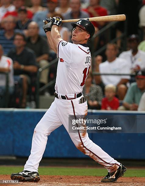 Chipper Jones of the Atlanta Braves hits against the Boston Red Sox at Turner Field on June 18, 2007 in Atlanta, Georgia. The Braves defeated the Red...