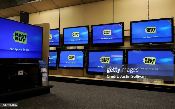 Wall of flat panel televisions are displayed the Best Buy logo at a Best Buy store June 19, 2007 in San Francisco, California. Consumer electronics...