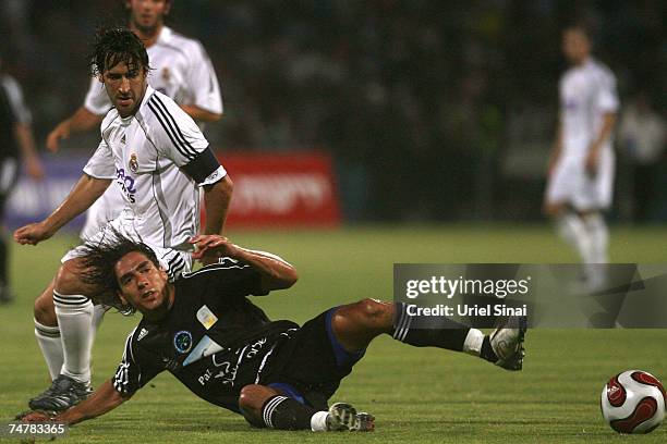 Raul Gonzalez of Real Madrid challenges Yoav Ziv of the Peace Team during the match between Real Madrid and a Palestinian & Israeli XI at the Ramat...