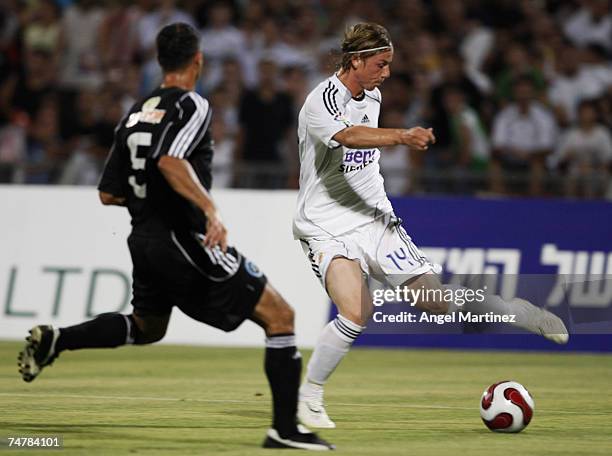 Guti of Real Madrid vies with Alon Harazi of the Peace Team during the friendly match between Real Madrid and Palestinian & Israeli XI at the Ramat...