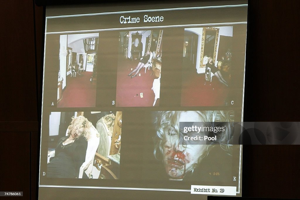 Projected crime scene photos are displayed of Lana Clarkson's body