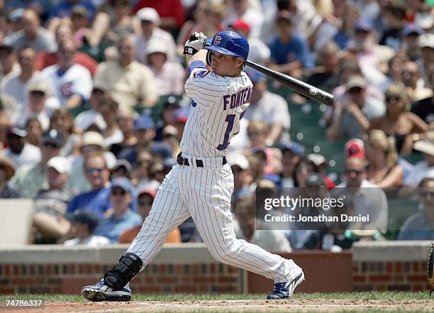 Mike Fontenot of the Chicago Cubs hits a triple and drives in a run in the 1st inning against the Seattle Mariners at Wrigley Field June 14, 2007 in...