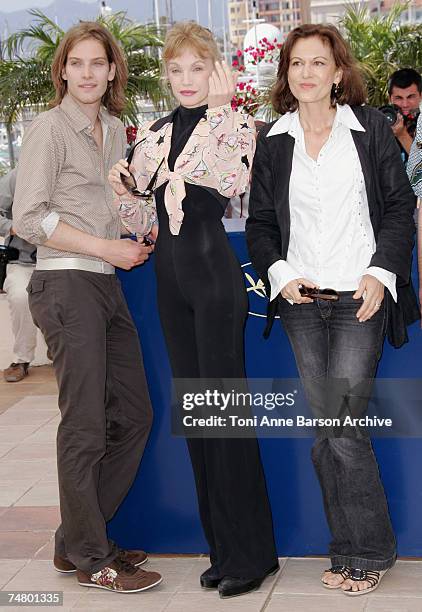 Andy Gillet, Arielle Dombasle and Anne Fontaine at the Palais des Festival Terrace in Cannes, France.