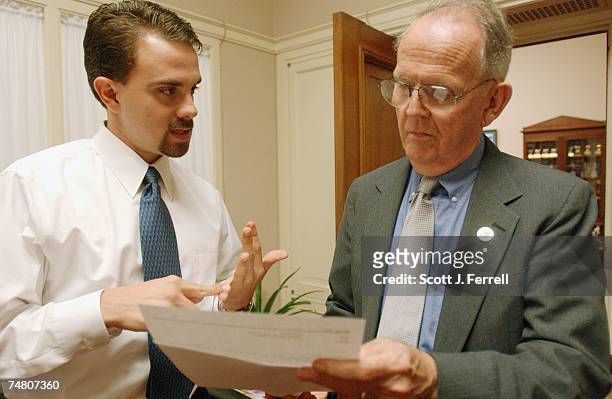 Legislative assistant Tim Linker talks with Cass Ballenger, R-N.C., in Ballenger's office in the Rayburn House Office Building.