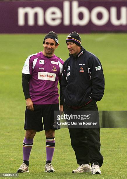 Matthew Johns and Craig Bellamy the coach of the Storm speak during a Melbourne Storm NRL training session held at MC Labour Park on June 20, 2007 in...