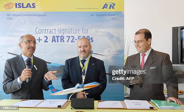 European aircraft manufacturer ATR Chairman of the Board Filippo Bagnato talks as Spanish company Islas Airways CEO Miguel Caceres and ATR CEO...