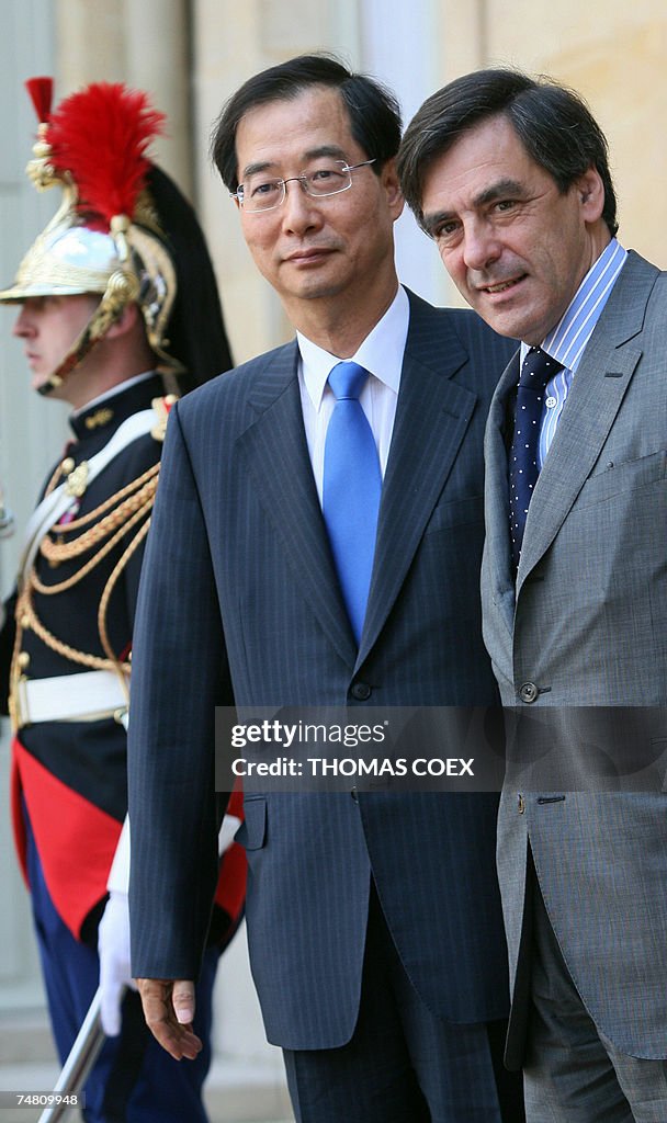 French Prime minister Francois Fillon (R...
