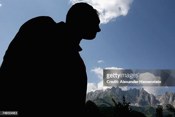 And IBO World Heavyweight Champion Wladimir Klitschko of Ukraine looks on the Tyrolian Mountains "Wilder Kaiser" during a photocall on June 20, 2007...