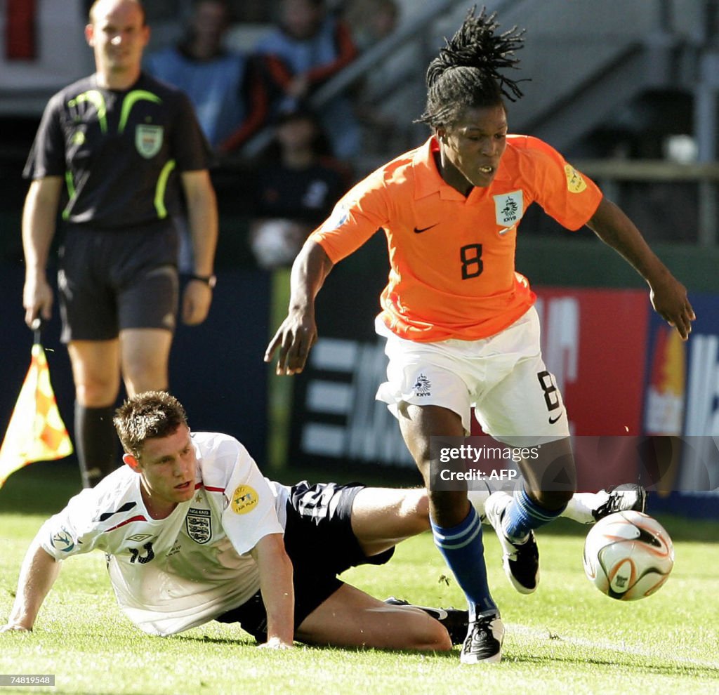 Netherlands player Royston Drenthe (R) p...