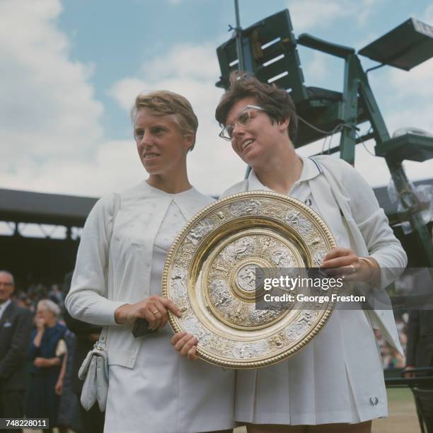 American tennis player Billie Jean King holds the trophy after beating Ann Haydon-Jones of Great Britain, 3-6, 4-6, to win the Ladies' Singles final...