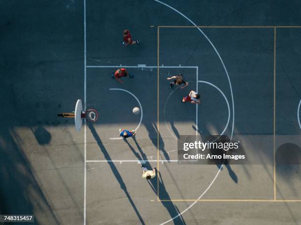 Overhead view of friends on basketball court playing basketball game