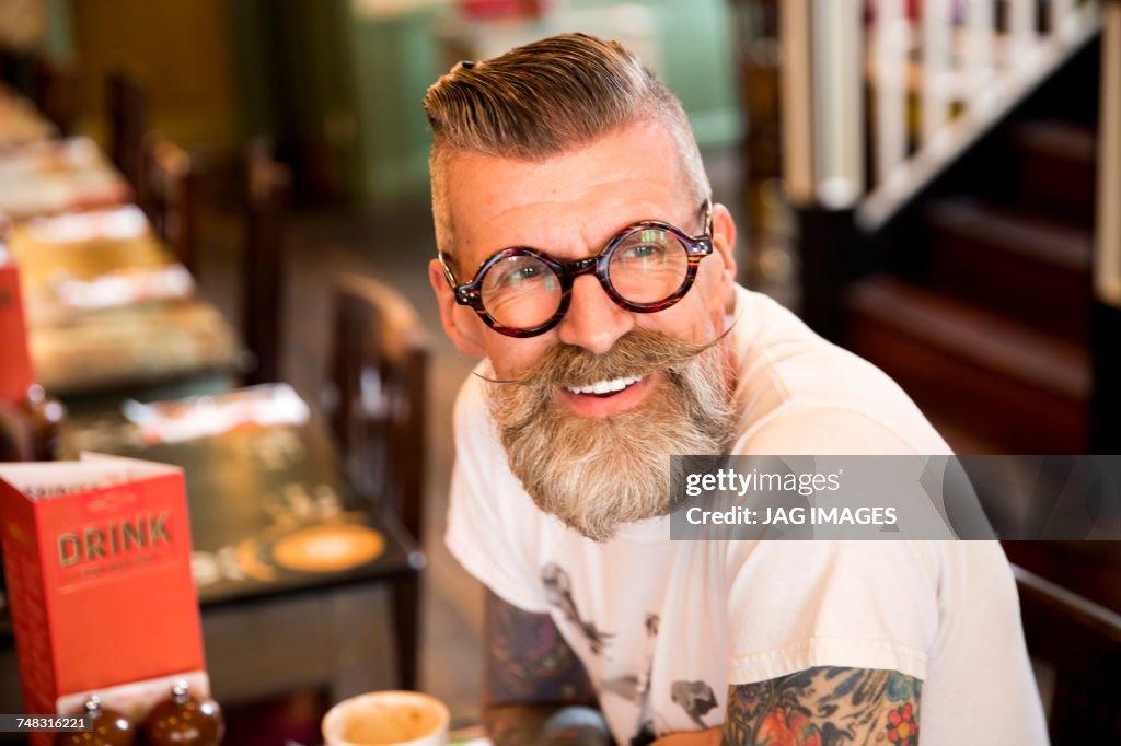 Quirky man in bar and restaurant, Bournemouth, England