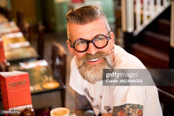 quirky man in bar and restaurant, bournemouth, england - pelo facial imagens e fotografias de stock