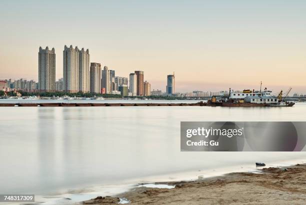 waterfront skyscrapers, harbin, heilongjiang, china - songhua river stock pictures, royalty-free photos & images