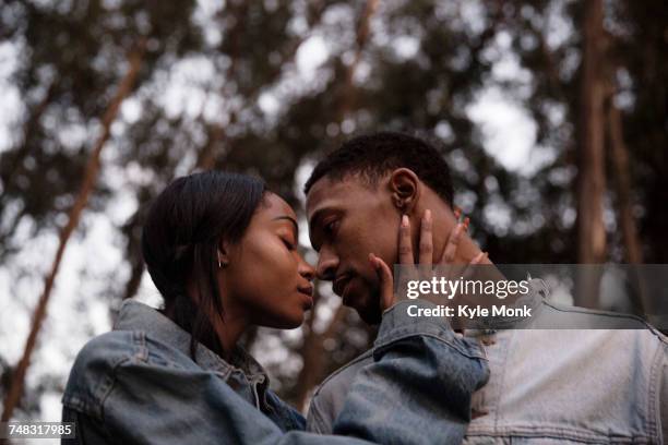 couple rubbing noses - nuzzling stockfoto's en -beelden