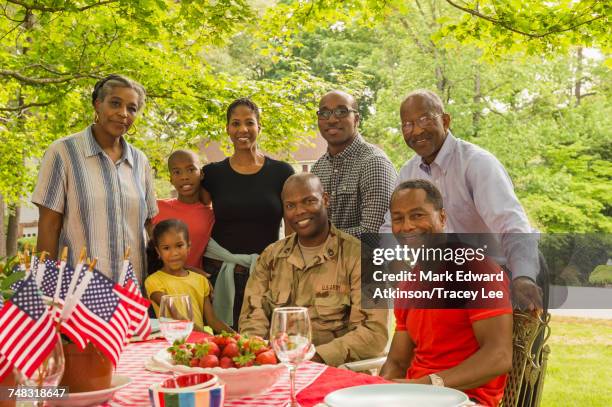 portrait of smiling multi-generation family at picnic - military bowl stock pictures, royalty-free photos & images